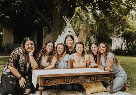 Girls around a picnic table